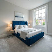 Blue Valencia bed frame with 54 inch thick wing line headboard