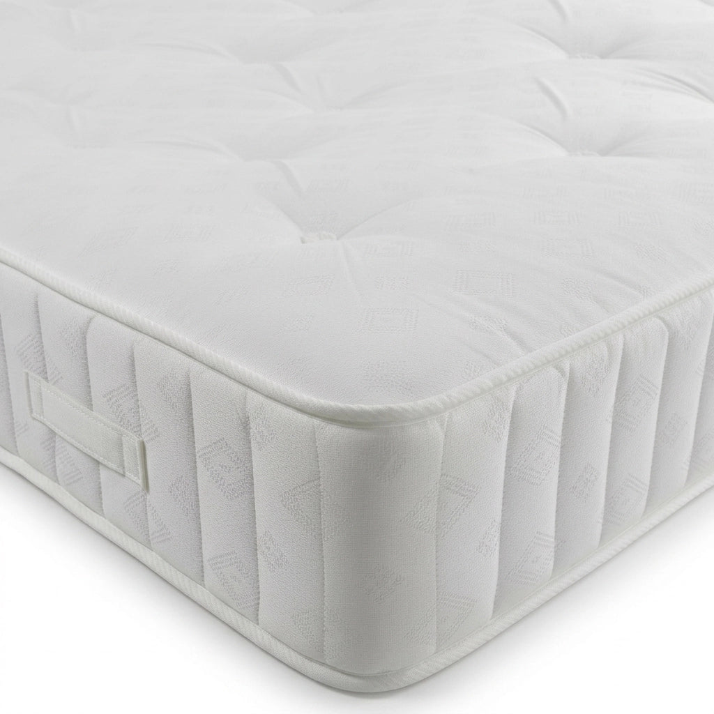 Roslin open coil mattress close-up showing tufted top and quilted border